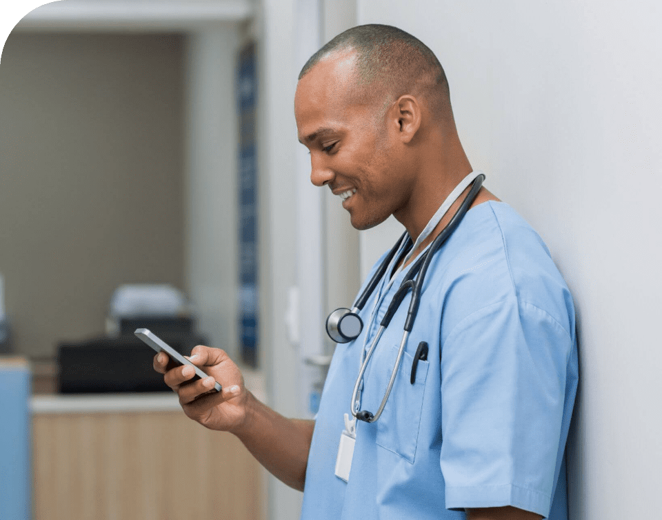 Doctor checking messages on a mobile