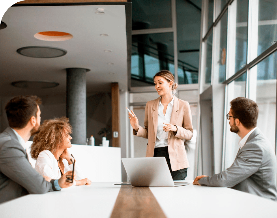 woman facilitating a meeting with employees